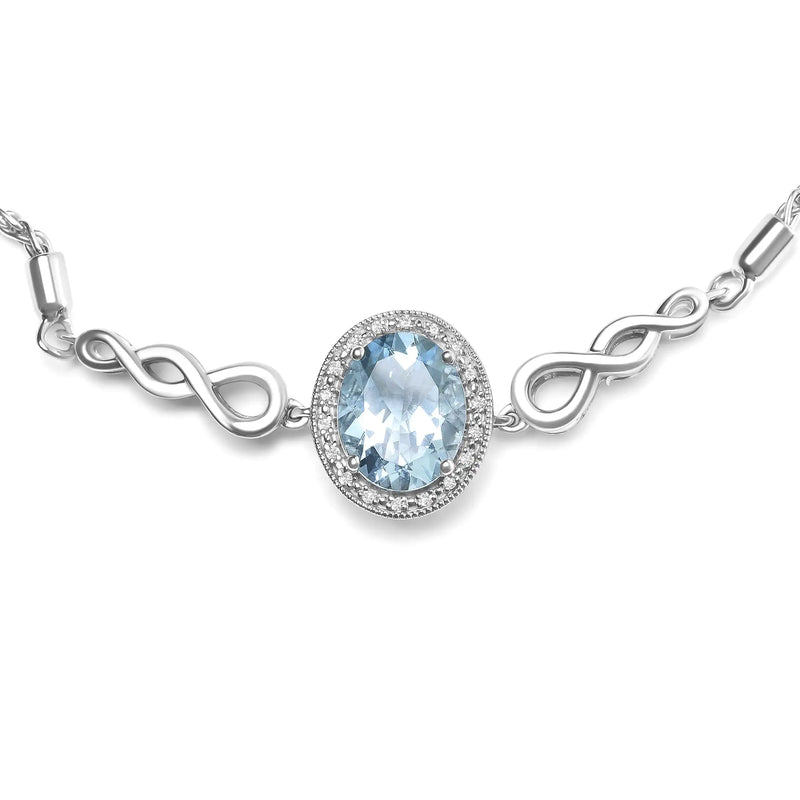 .925 Sterling Silver 10x8mm Oval Blue Topaz and Diamond Accent Bracelet - The Snow Owls