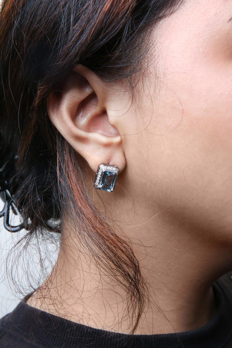 18K White Gold 3/4 Cttw Round Diamond and 13x9mm Emerald Cut Blue Aquamarine Gemstone Halo Omega Stud Earrings (G-H Color, SI1-SI2 Clarity) - The Snow Owls