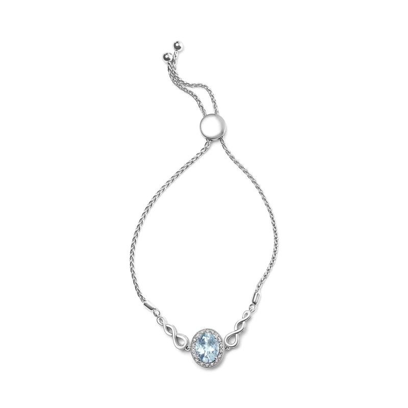 .925 Sterling Silver 10x8mm Oval Blue Topaz and Diamond Accent Bracelet - The Snow Owls