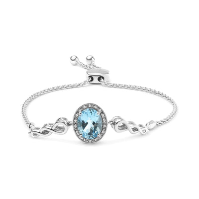 .925 Sterling Silver 10x8mm Oval Blue Topaz and Diamond Accent Bracelet - The Snow Owls